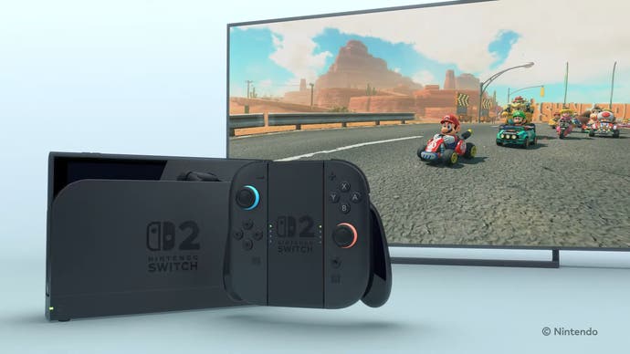 Switch 2 trailer screenshot showing Switch 2 console and Mario Kart running on a TV in the background