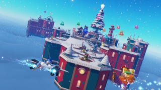 Astro Bot Winter Wonder update level showing a festive area covered in snow with a large Christmas tree in the background