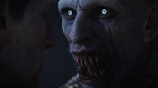 A shot from The Blood of Dawnwalker's cinematic trailer showing a close-up of a snarling vampire with glowing white eyes and a mouthful of long-bloodied teeth.