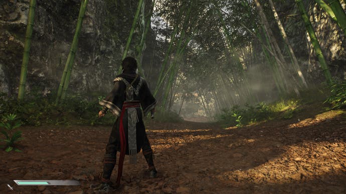 Dynasty Warriors: Origins screenshot of a country path with rows of tall bamboo either side.