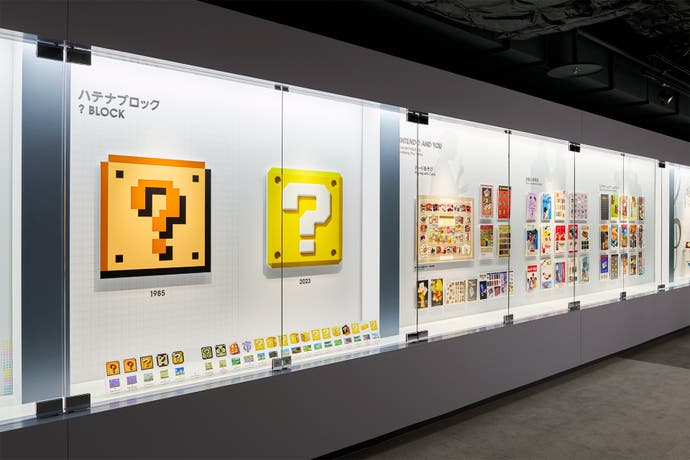 A wall showcasing the evolution of the question mark block in the Nintendo Museum.