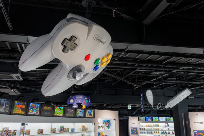 A giant N64 controller, suspended from the ceiling of the Nintendo Museum.