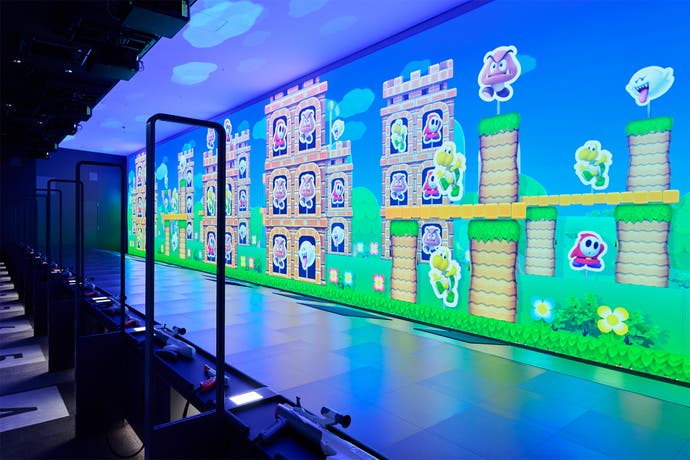 The Zapper lightgun room in the Nintendo Museum, with a large, wall to ceiling display showing various character targets in a scene from the Mushroom Kingdom.