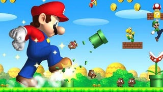 Screenshot of a giant Super Mario stomping on goombas