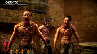 In a dimly lit environment, two grotesque zombies with scars and injuries stand close together, facing a character who holds an axe. The character is partially obscured but appears to be in an attacking stance. The background features brick walls and decorative stone elements