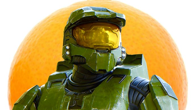 Master Chief stands in front of a large orange.